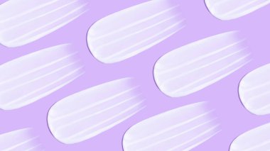 Arka plan kozmetik. Pembe bir arka planda bir sürü krem lekesi