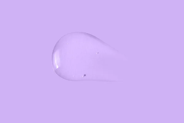 Textura Una Gran Mancha Gel Transparente Sobre Fondo Púrpura —  Fotos de Stock