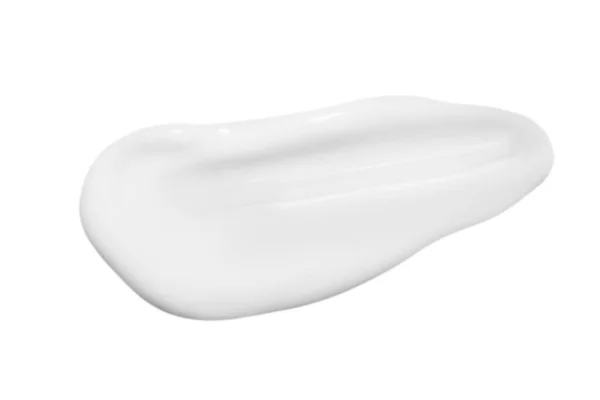 Una Gota Líquido Untado Crema Blanca Sobre Fondo Blanco Aislado — Foto de Stock