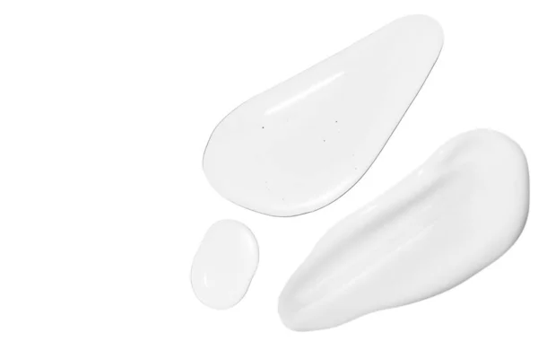 Капли Прозрачного Геля Немного Белого Косметического Крема Белом Фоне — стоковое фото