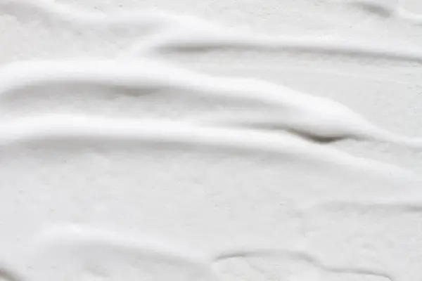 Sebuah Tekstur Dioleskan Busa Putih Seluruh Latar Belakang — Stok Foto