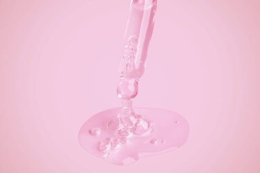 Pipetten akan berrak bir jel. Büyük bir damlada bir sürü akıcı jel. Baloncuklu. Pembe bir arka planda.