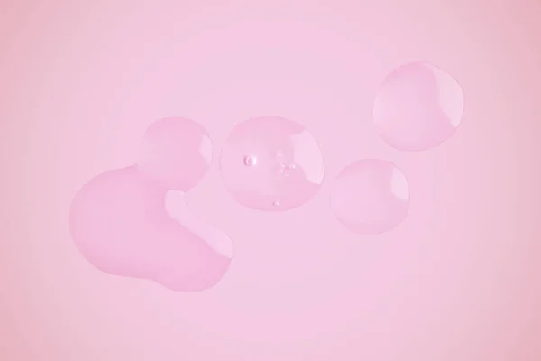 Droppar Transparent Gel Rosa Bakgrund — Stockfoto