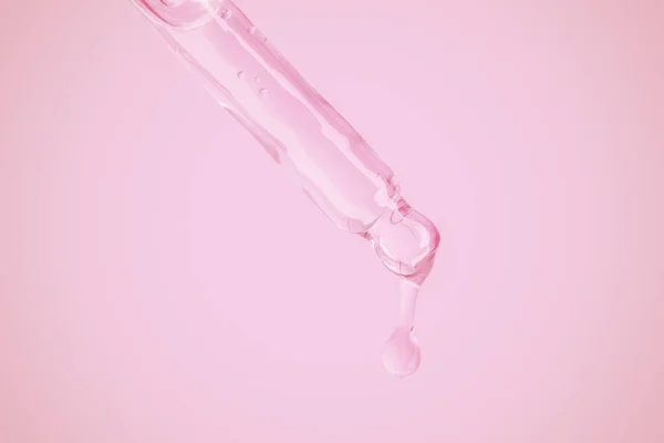 Auslaufendes Transparentes Gel Aus Einem Augentropfen Auf Rosa Hintergrund Blasen — Stockfoto