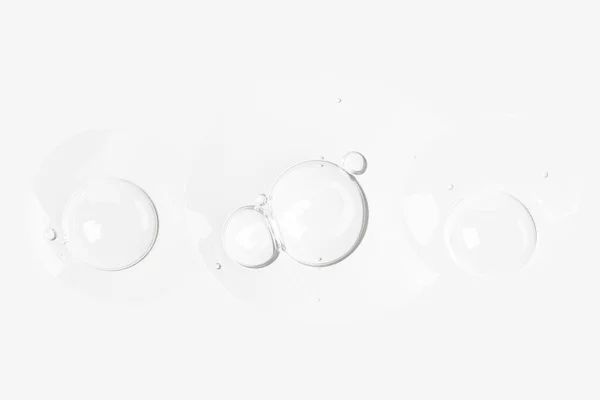 抽象的な泡の背景 化粧品の液体 顔の血清の質感 コラーゲン 慢性的な顔 美容室 明確な泡 空気の泡 ゲルの質感 透明なゲル — ストック写真