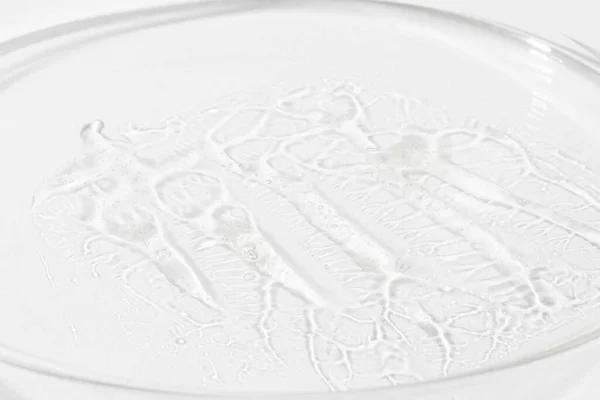液体ゲルの質感 ペトリ皿透明美容液の背景にヒアルロン酸ゲルの透明感のある質感 透明な製品 — ストック写真