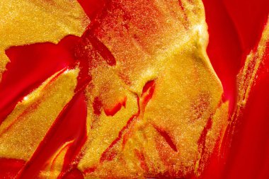 Büyük sarı ve kırmızı boya vuruşlarının arka planı.