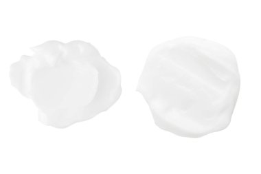 Beyaz arka planda bir dizi beyaz krem..