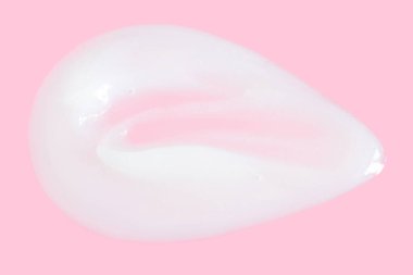 Yağlı bir leke. Pembe arka planda krema. 