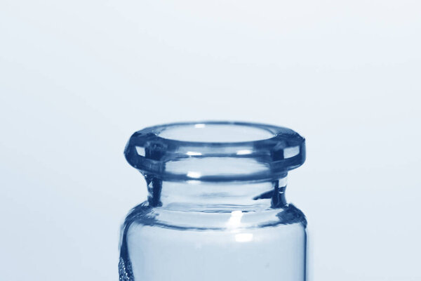 Transparent jar neck close-up with blue shades