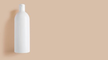 Beyaz kozmetik kavanozu. Bej arkaplanda