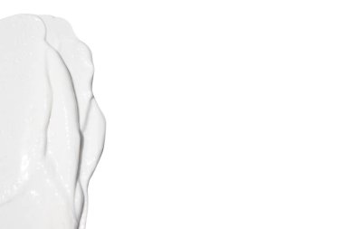 Beyaz arkaplana sürülmüş beyaz kozmetik krem