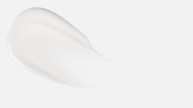 Beyaz arka planda bir krem lekesi