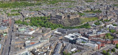 When disrespect for Art occurs in Architecture, we have examples like this one in which the monumental part of the city of Edinburgh is attacked by modern office buildings. clipart