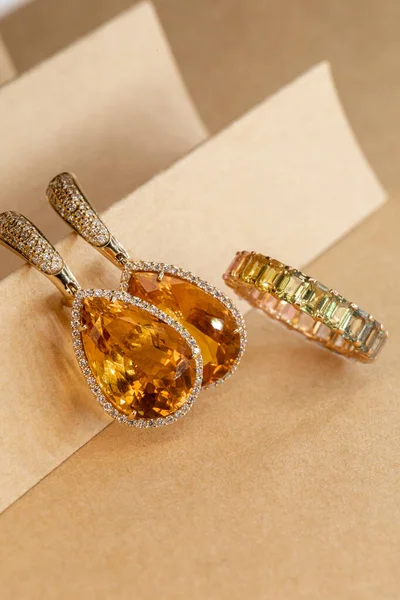 golden earrings with diamonds and precious stones