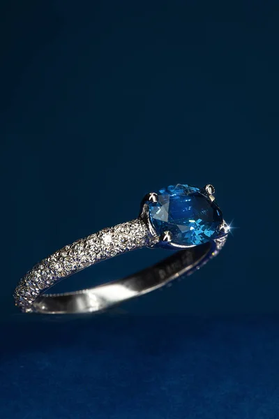 Golden ring with precious stones. Diamonds and precious stones. Macro