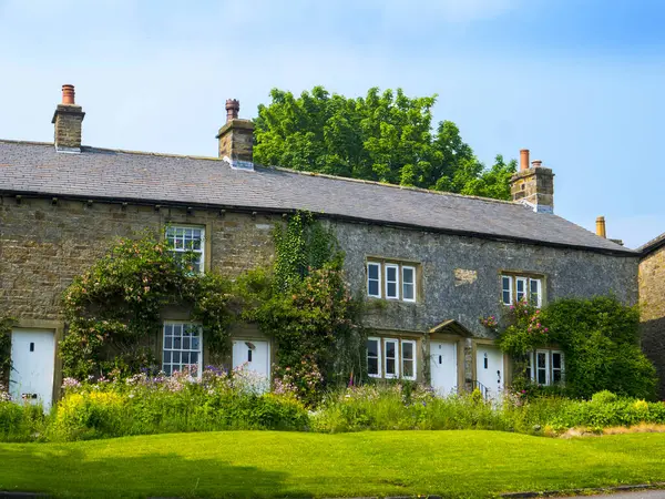 stock image Downham in Lancashire,The beautiful village of Downham in the Forest of. Bowland Area of Outstanding Natural Beauty lies at the foot of Pendle Hill, Downham is a village under Pendle Hill. It is in the Ribble Valley district 