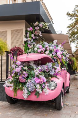 pink and purple flowers in car. clipart