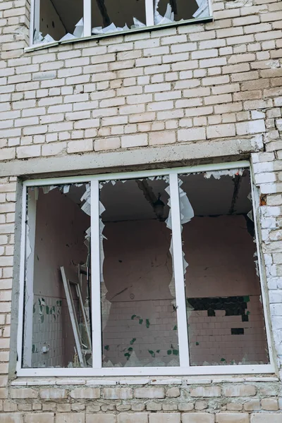 stock image Bilozirka, Ukraine - March 26, 2023: War of Russia against Ukraine. Damaged and destroyed kindergarten in village after bomb explosions. Holes in the windows. Total ruins, Devastation