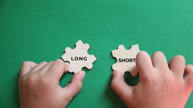 Yapbozu tutan eller Uzun Kısa yazıldı