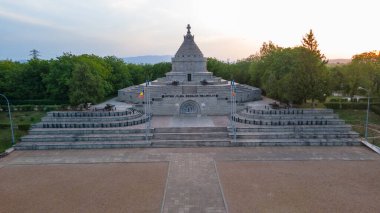 Aerial view of The Mausoleum of  Heroes of World War I from Marasesti, Romania. Photography was taken from a drone at a higher altitude at sunset with the building in the view. clipart