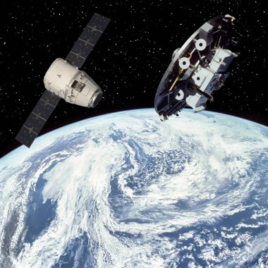 Dünya 'nın üstünde uzay gemileri. Bu görüntünün elementleri NASA tarafından sağlanmıştır.