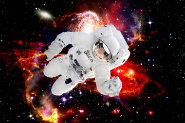 Arka planda astronot ve galaksi var. Bu görüntünün elementleri NASA tarafından sağlanmıştır.