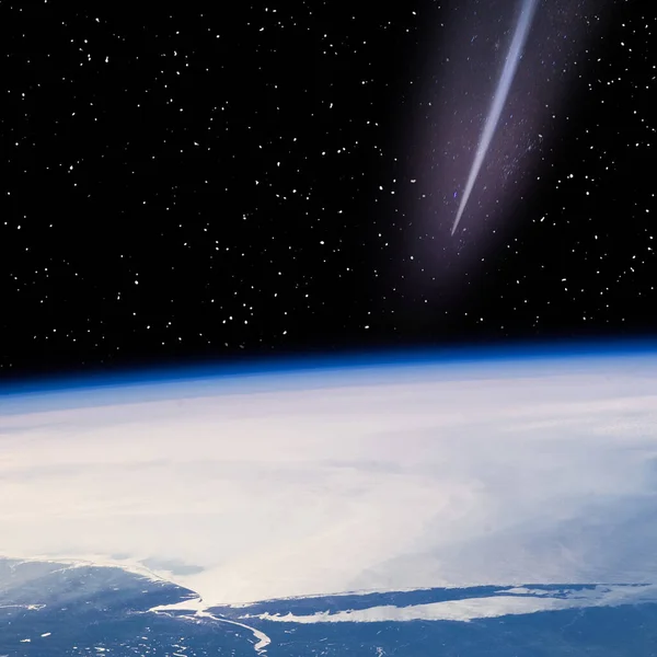 stock image Comet flying above the earth. The elements of this image furnished by NASA