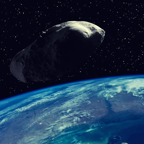 stock image Asteroid flying above the earth. Elements of this image furnished by NASA.