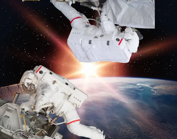 stock image Astronauts flies in space. The elements of this image furnished by NASA