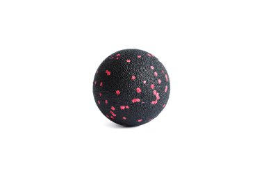 Massage black ball with pink spots for trigger points isolated on a white background. Concept of myofascial release. clipart