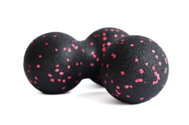 Massage set: A black pink ball and mfr double ball isolated on a white background. Close-up. Foam rolling is a self myofascial release technique. Concept of fitness equipment. clipart