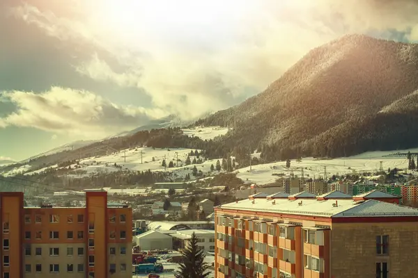 stock image View of a town in winter season.Beautiful snowy mountains in background. High quality photo