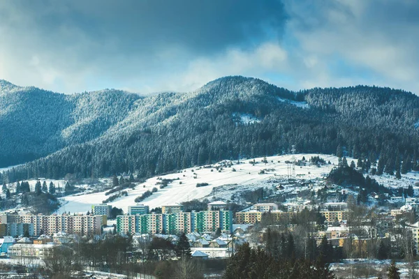 stock image View of a town in winter season.Beautiful snowy mountains in background. High quality photo