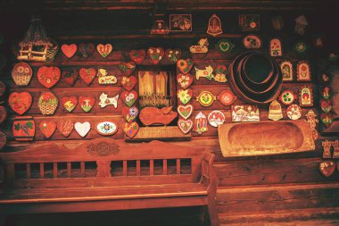 Facade of a log house with colorful decorations. High quality photo