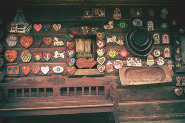 Facade of a log house with colorful decorations. High quality photo