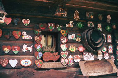Facade of a log house with colorful decorations. High quality photo