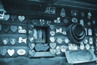 Facade of a log house with colorful decorations. High quality photo