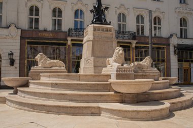 Budapest,Hungary - July 5, 2023 : Lion Fountain at Vorosmarty Square. High quality photo clipart