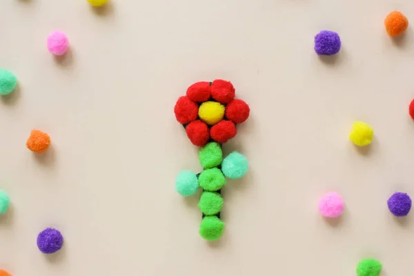 Early learning ideas. Flower from pom pon, felt. Activities for Toddlers and Preschool Children. Montessori. Step by step. Step 3