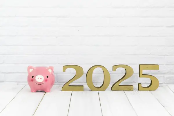 stock image 2025 Financial Planning: Pink Piggy Bank and Golden Numerals on White Background