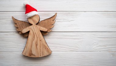 Wooden Christmas Angel with Santa Hat for Rustic Holiday Decor clipart