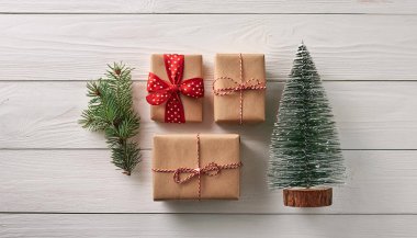 Christmas Gifts Wrapped in Kraft Paper with Pine Branch and Miniature Christmas Tree clipart