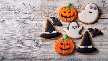 Spooky Halloween Iced Cookies Assortment with Pumpkins, Ghosts, and Witches Hats clipart