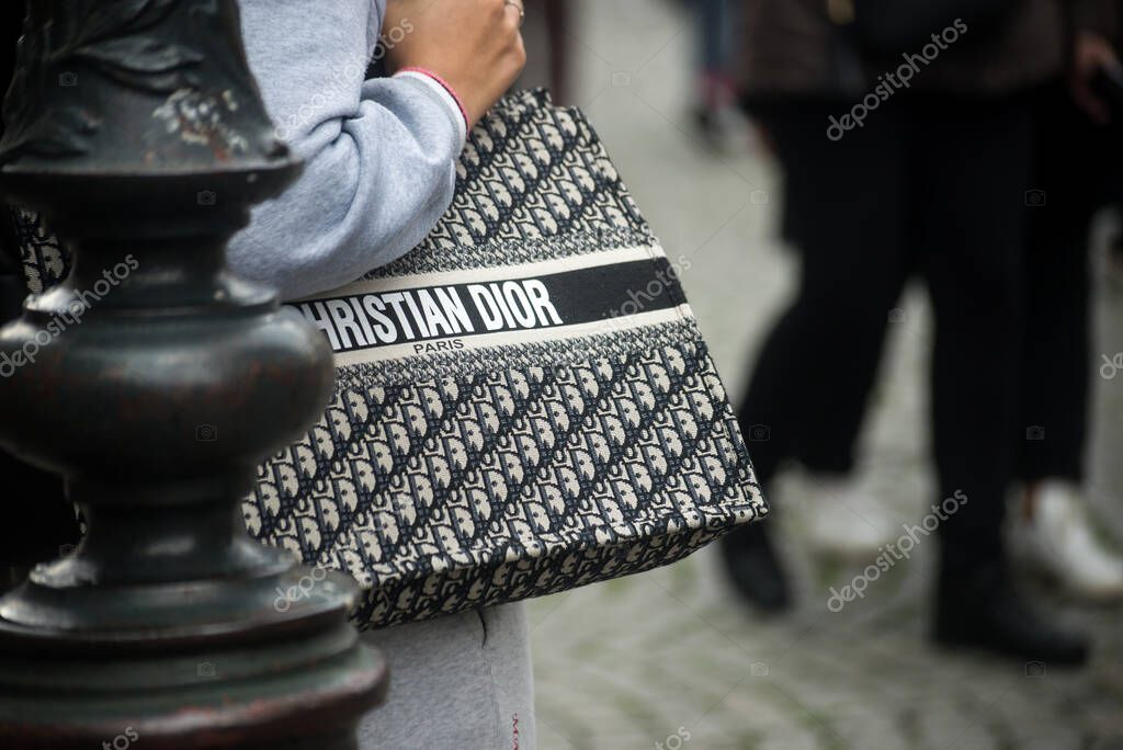 Strasbourg - France - 19 November 2022 - Closeup of woman with a Christian Dior hand bag standing in the street