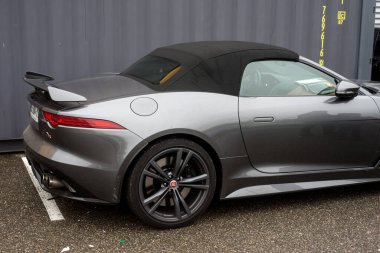 Mulhouse - France - 9 October 2022 - rear view of grey Jaguar F type parked in the street 