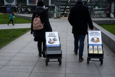 Strasbourg - France - 21 January 2023 - Portrait on back view of Jehovah witnesses standing in the street clipart