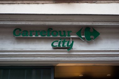 Colmar - France - 25 January 2023 - closeup of carrefour city signage on supermarket store front in the street 