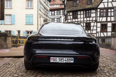 Strasbourg - France - 21 January 2023 - Rear view of black Porsche Taycan 4S parked in the street