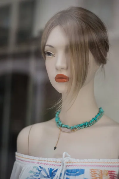 Closeup of  mannequin in a women fashion store showroom